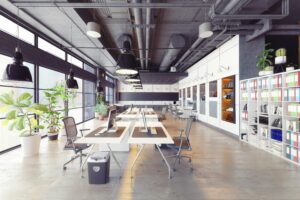 Open-plan office with shared desks and painted interior walls